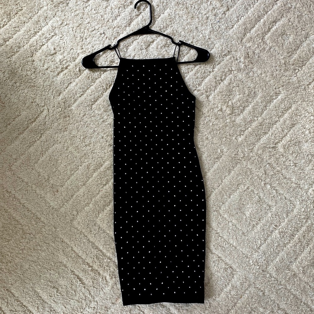A small black rhinestone fitted dress